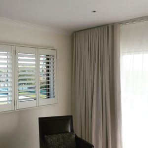 Combination of curtains and plantation shutters